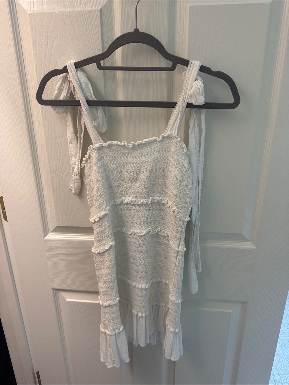 Olivaceous White Smocked Ruffled Tie-Strap Mini Dress